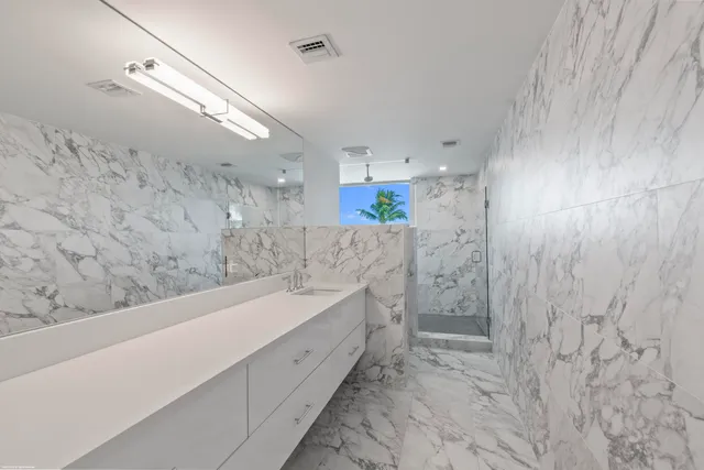 a view of a house with backyard sitting area and garden