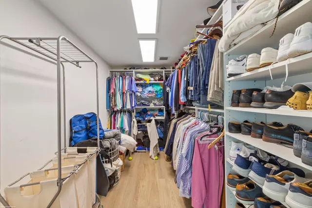 outdoor view of house with outdoor space and sitting area