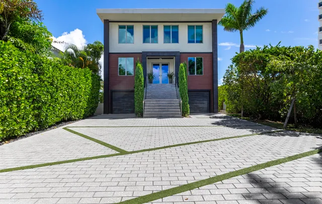 a room with lots of wooden furniture and chandelier