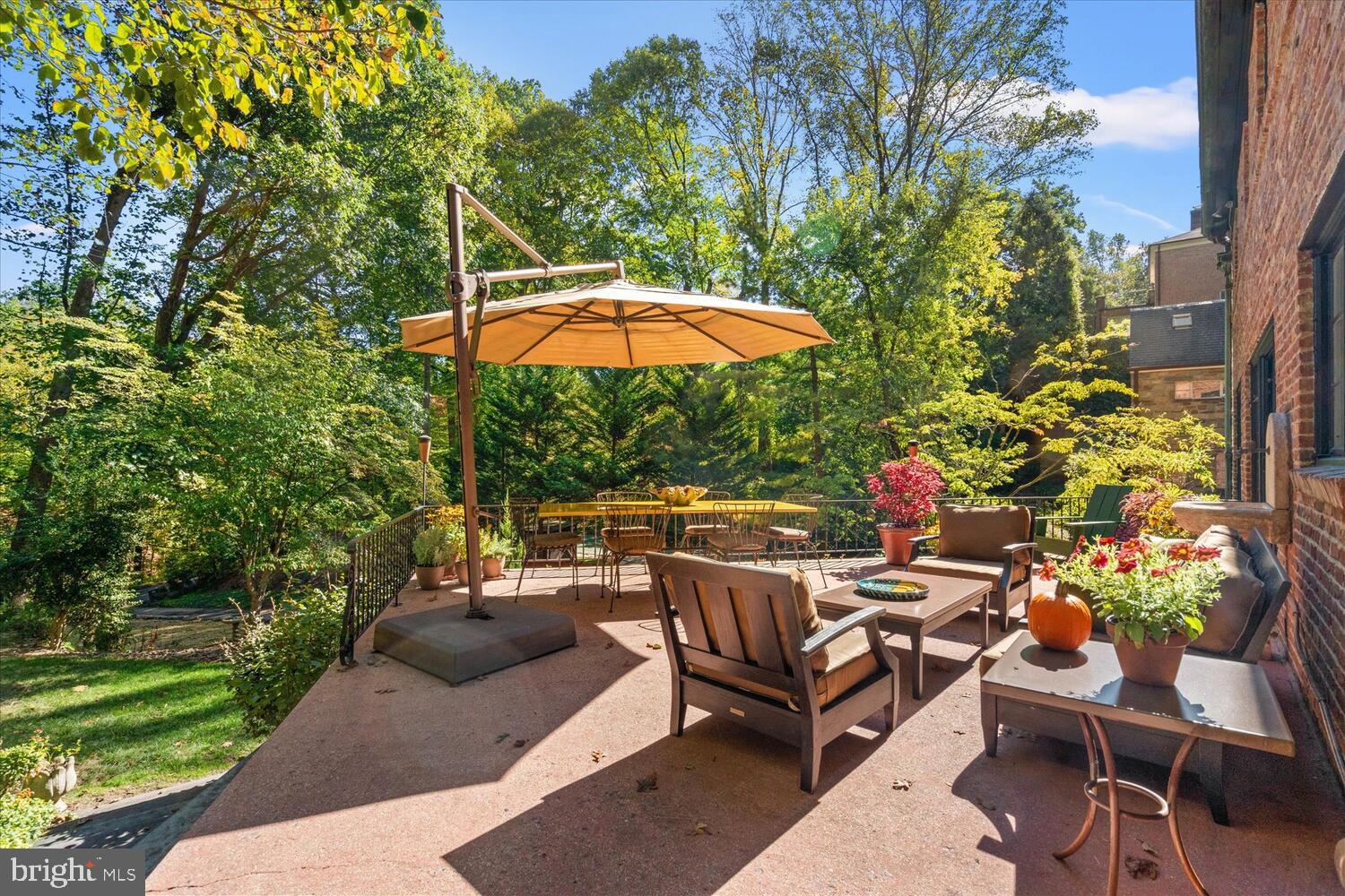 4838 Broad Branch Road Northwest Washington, DC 20008 - Photo 16 of 33 a view of a backyard with a patio and outdoor seating