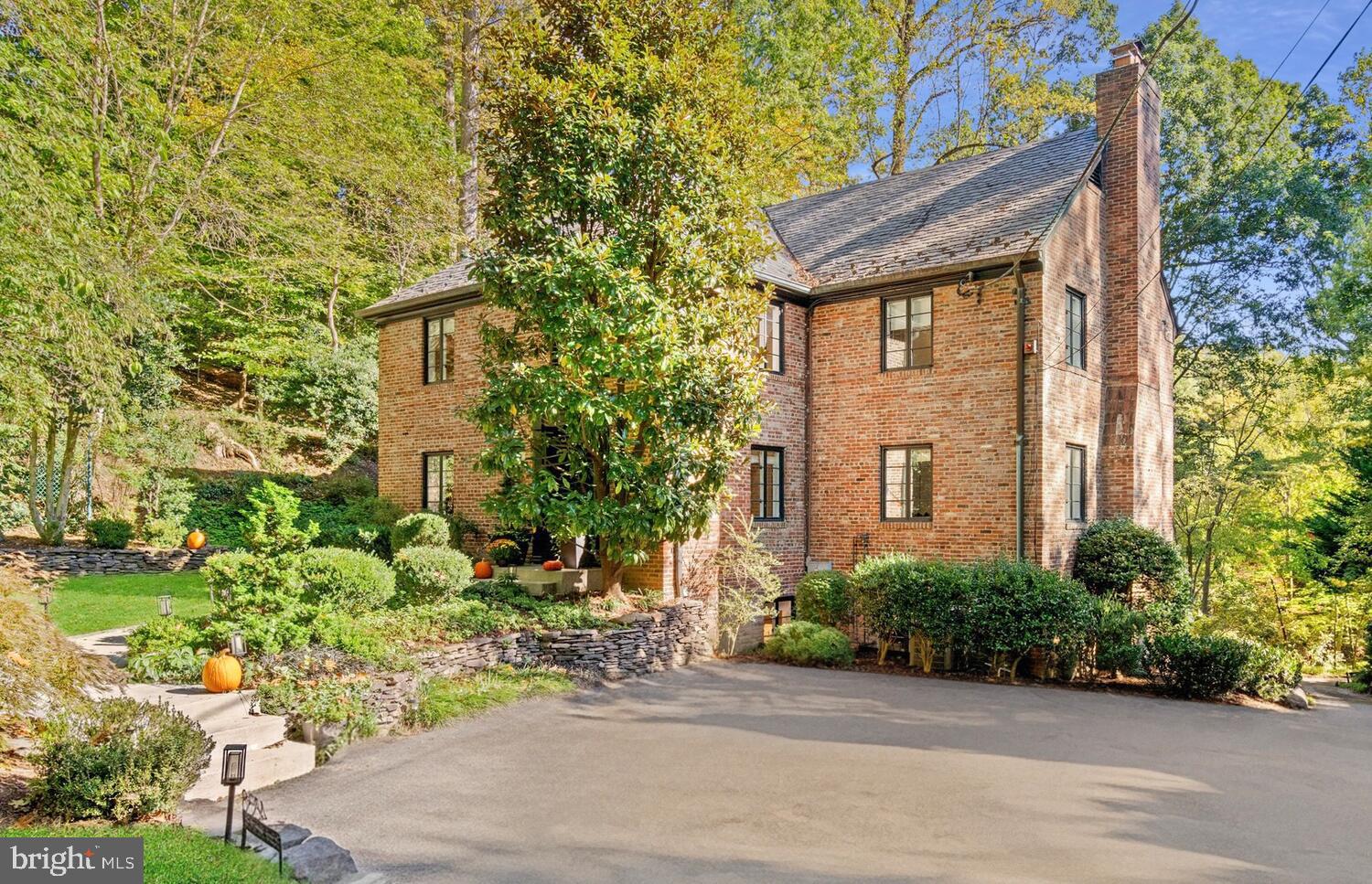 4838 Broad Branch Road Northwest Washington, DC 20008 - Photo 2 of 33 a front view of a house with garden