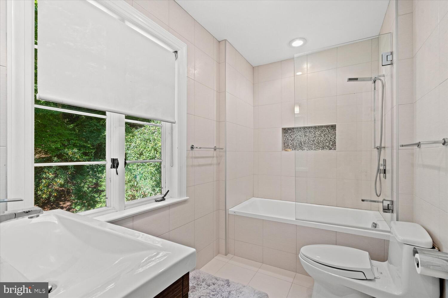 4838 Broad Branch Road Northwest Washington, DC 20008 - Photo 25 of 33 a bathroom with a toilet a sink and bathtub