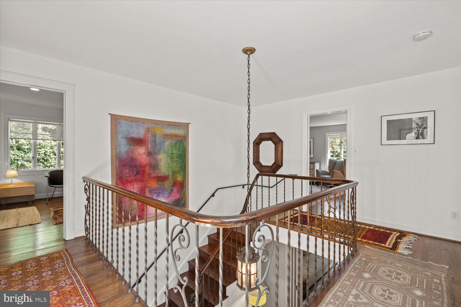 4838 Broad Branch Road Northwest Washington, DC 20008 - Photo 27 of 33 a view of a hallway with paintings on the walls