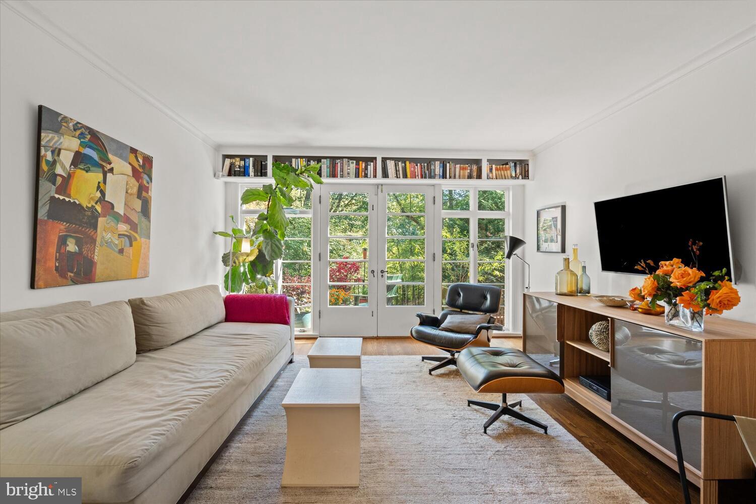 4838 Broad Branch Road Northwest Washington, DC 20008 - Photo 7 of 33 a living room with furniture and a flat screen tv