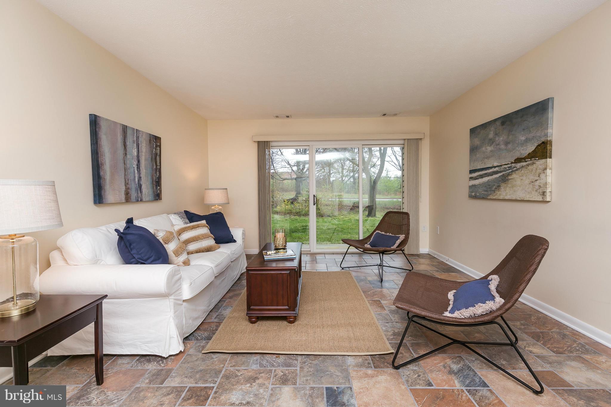 2572 Riva Road, Unit 4B Annapolis, MD 21401 - Photo 8 of 20 a living room with furniture and a floor to ceiling window