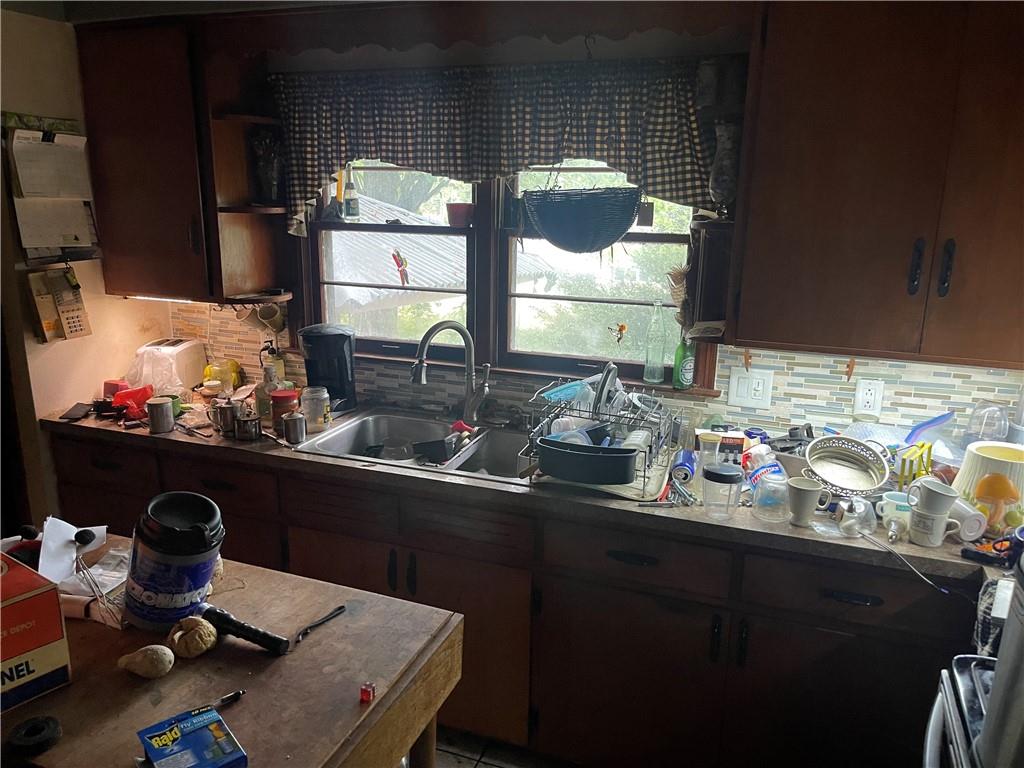 326 Frazier Drive New Castle, PA 16105 - Photo 18 of 27 a kitchen with a sink cabinets and a table
