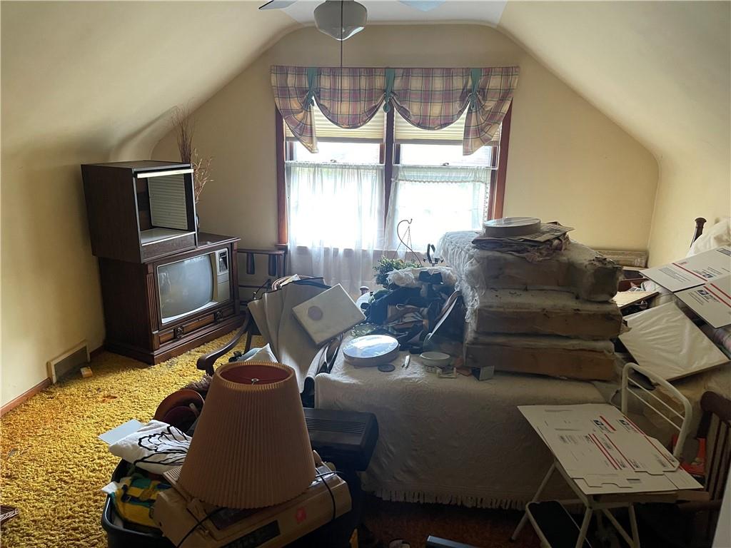 326 Frazier Drive New Castle, PA 16105 - Photo 20 of 27 a living room with furniture a window and a chandelier