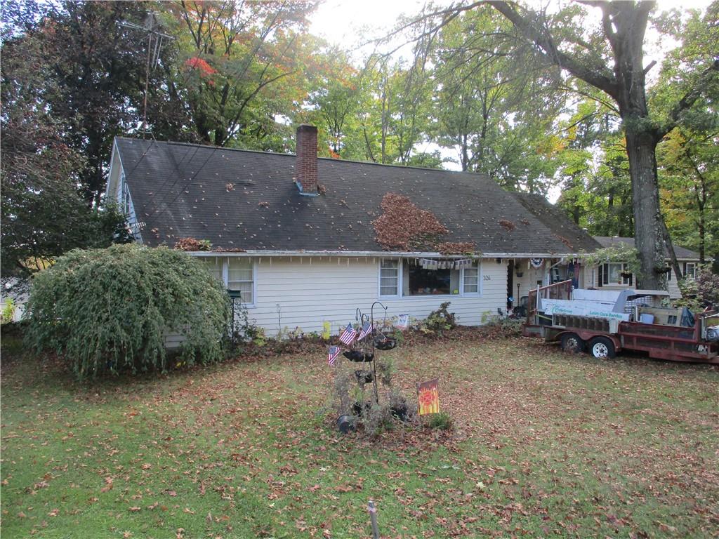 326 Frazier Drive New Castle, PA 16105 - Photo 2 of 27 a backyard of a house with barbeque oven table and chairs