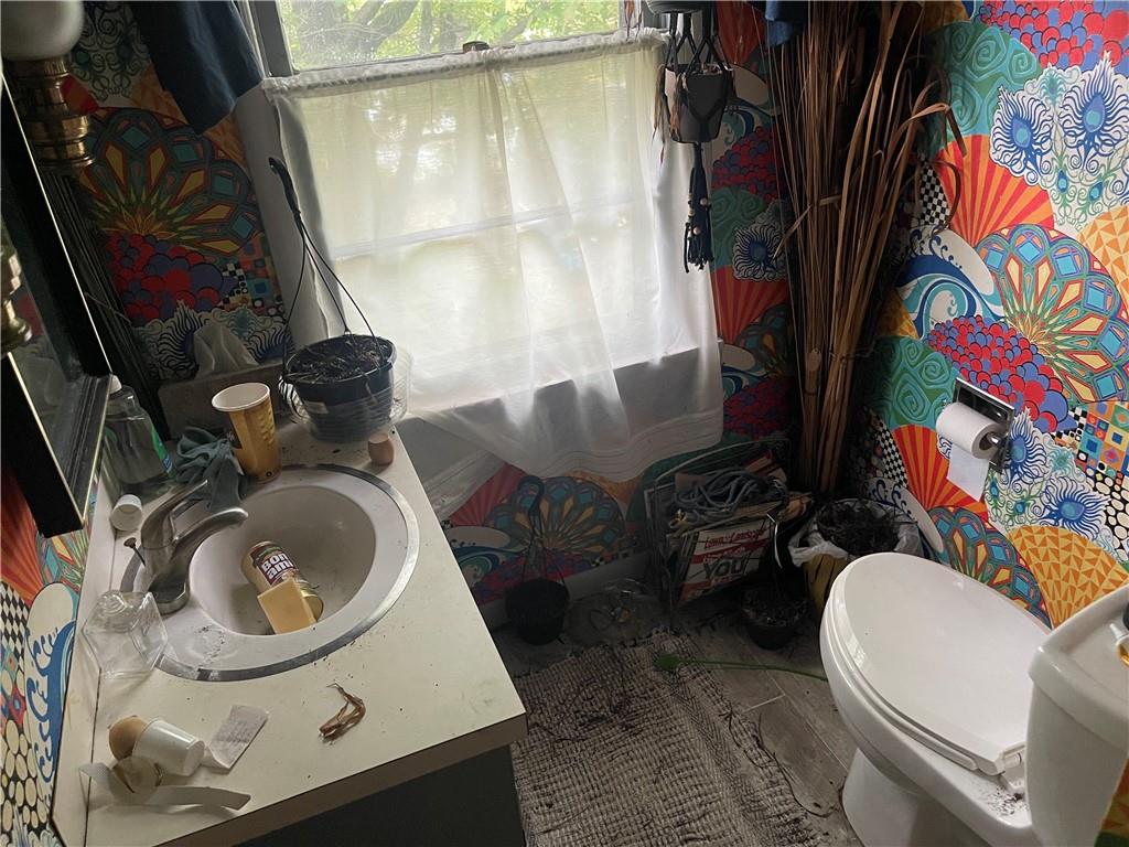 326 Frazier Drive New Castle, PA 16105 - Photo 24 of 27 a bathroom with a sink mirror vanity and toilet