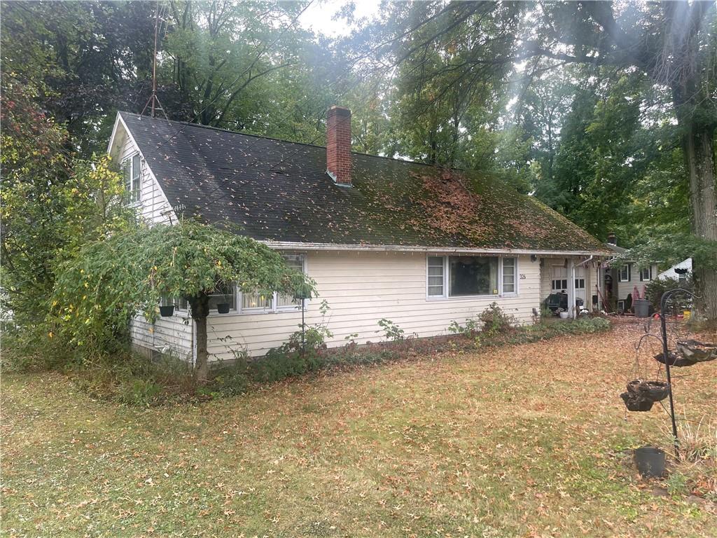 326 Frazier Drive New Castle, PA 16105 - Photo 4 of 27 a front view of a house with garden