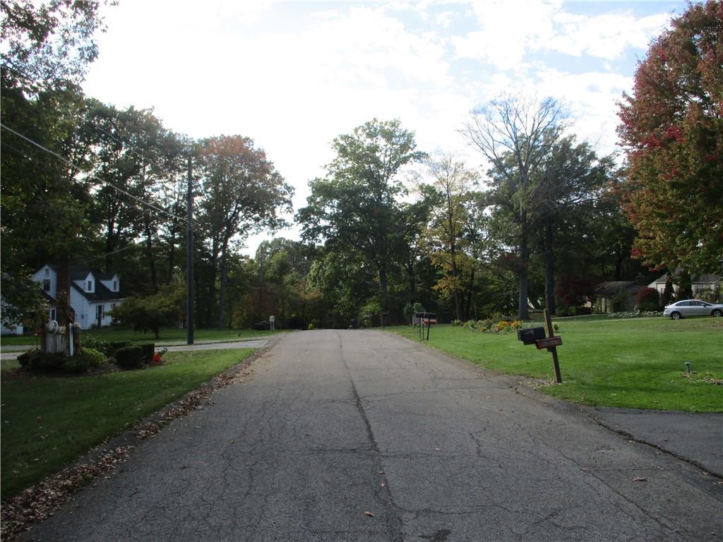 326 Frazier Drive New Castle, PA 16105 - Photo 6 of 27 a view of outdoor space with green field and trees