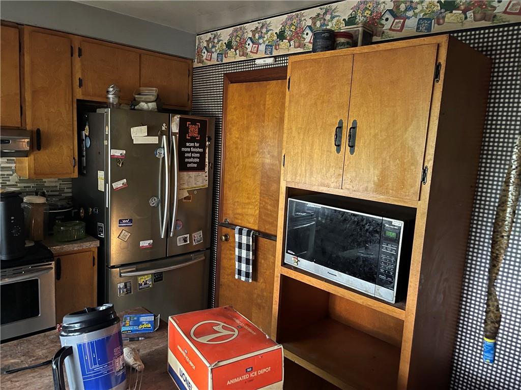 326 Frazier Drive New Castle, PA 16105 - Photo 8 of 27 a kitchen with stainless steel appliances a refrigerator and a stove