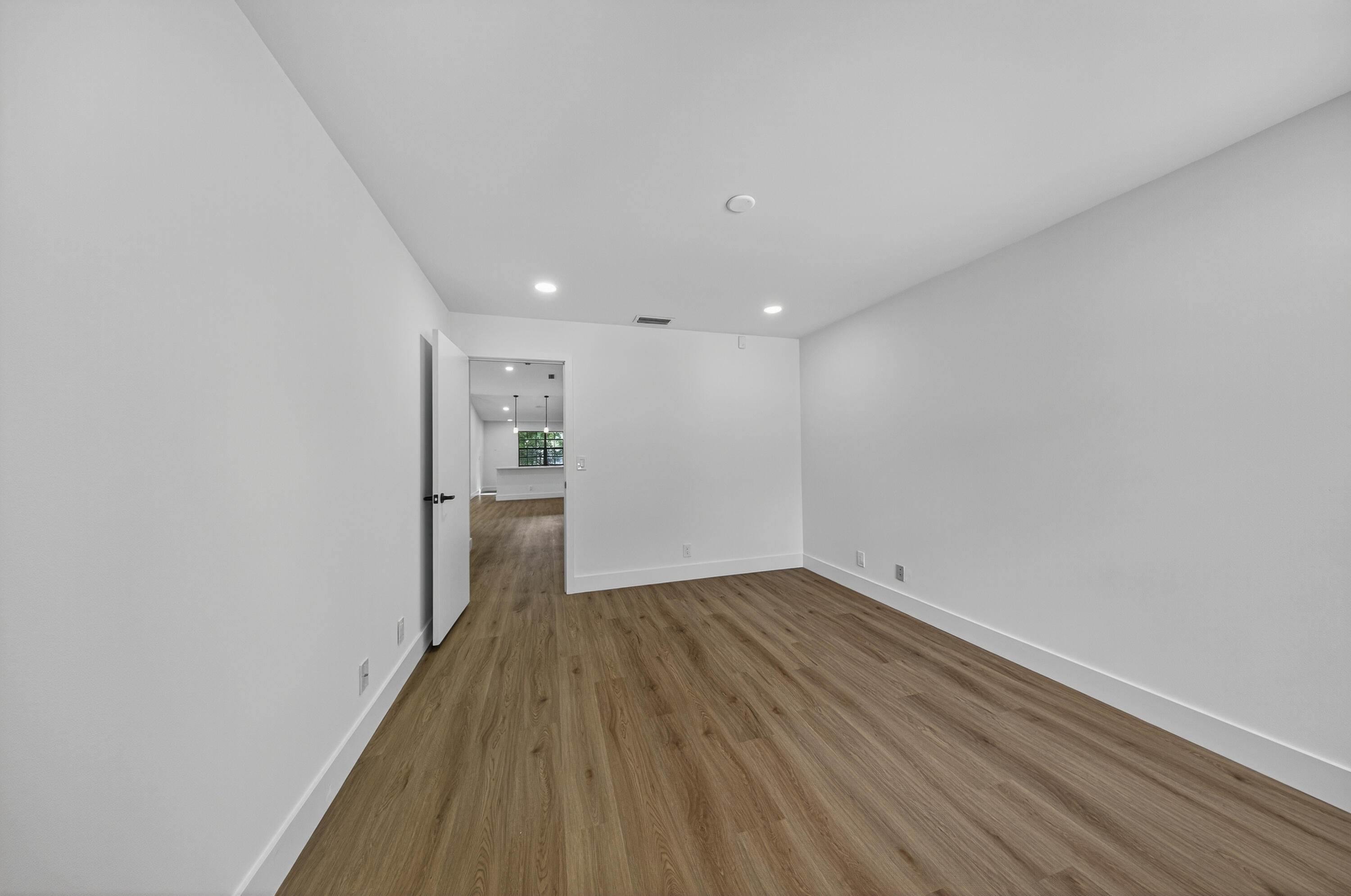 6040 Verde Trail South, Unit 3010 Boca Raton, FL 33433 - Photo 28 of 36 a view of a big room with wooden floor and windows