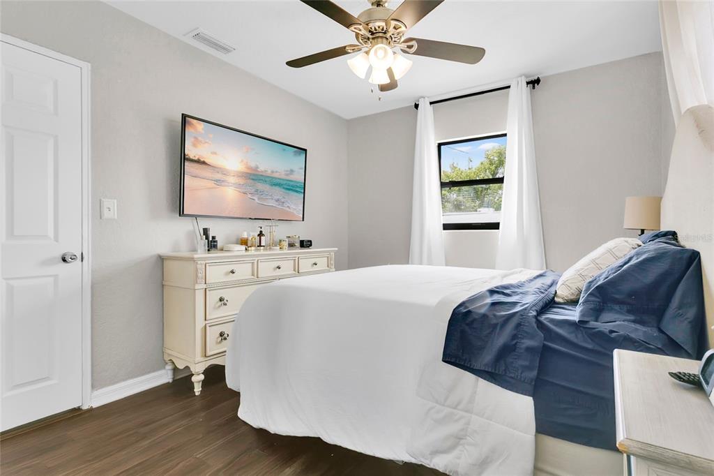 498 Clemson Drive Altamonte Springs, FL 32714 - Photo 11 of 31 a bedroom with a bed and a flat screen tv