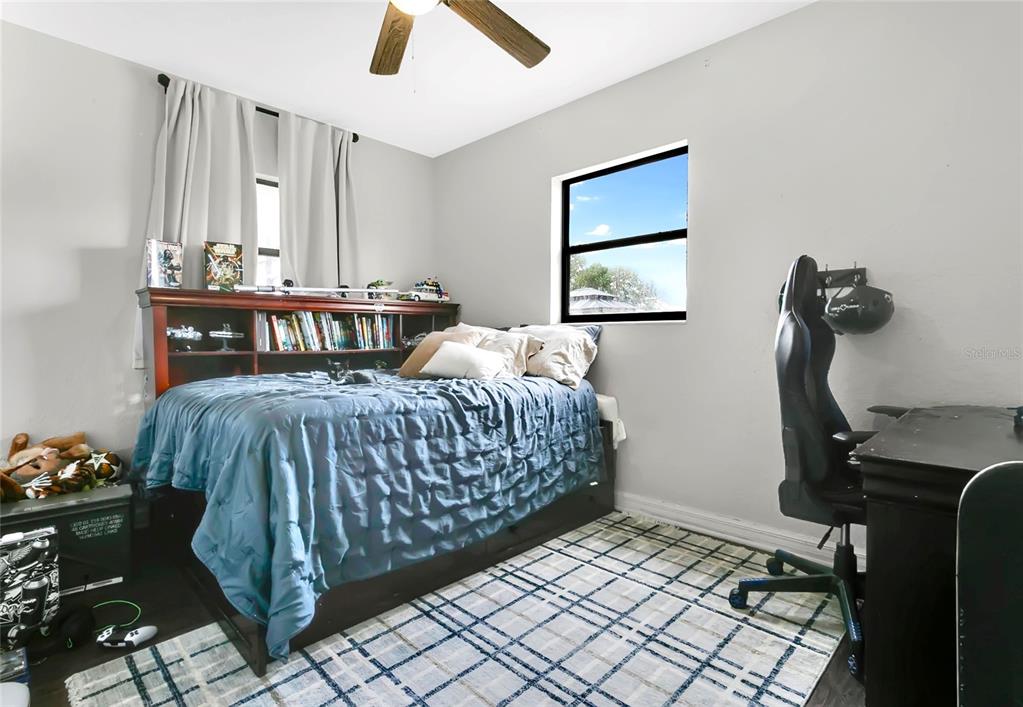 498 Clemson Drive Altamonte Springs, FL 32714 - Photo 12 of 31 a bedroom with furniture and a window