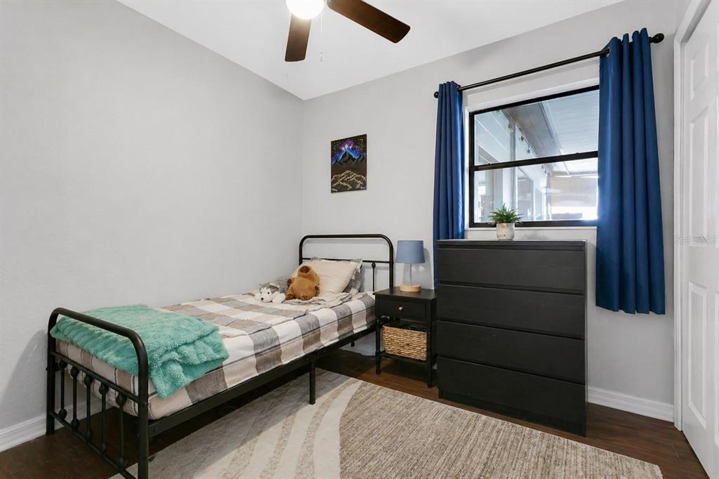498 Clemson Drive Altamonte Springs, FL 32714 - Photo 14 of 31 a bedroom with a bed and a window