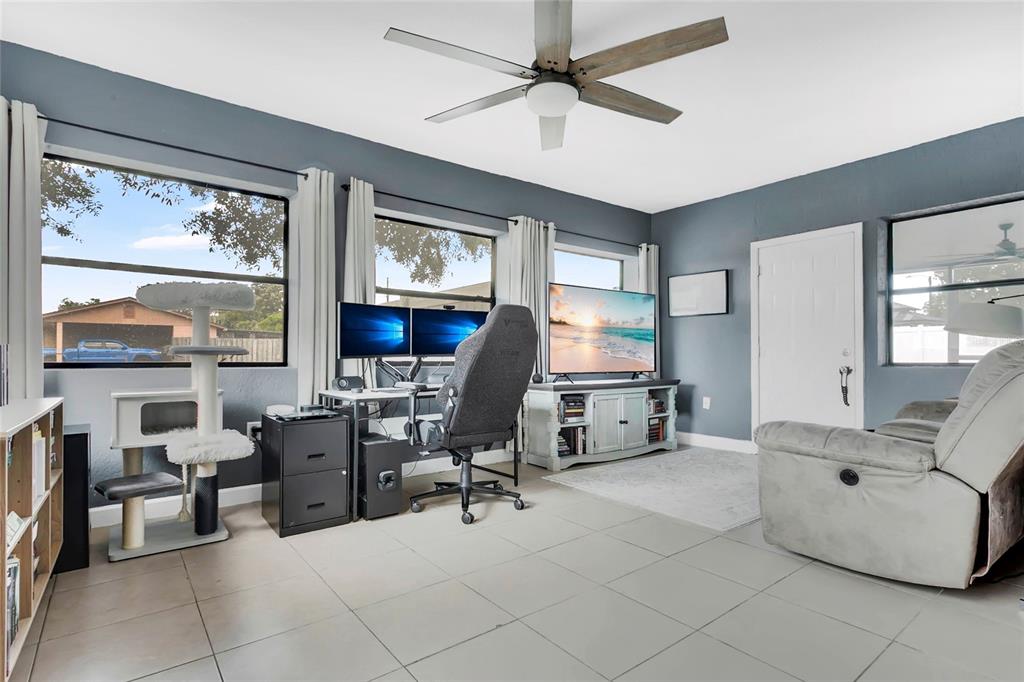 498 Clemson Drive Altamonte Springs, FL 32714 - Photo 16 of 31 a view of a workspace with furniture and a window