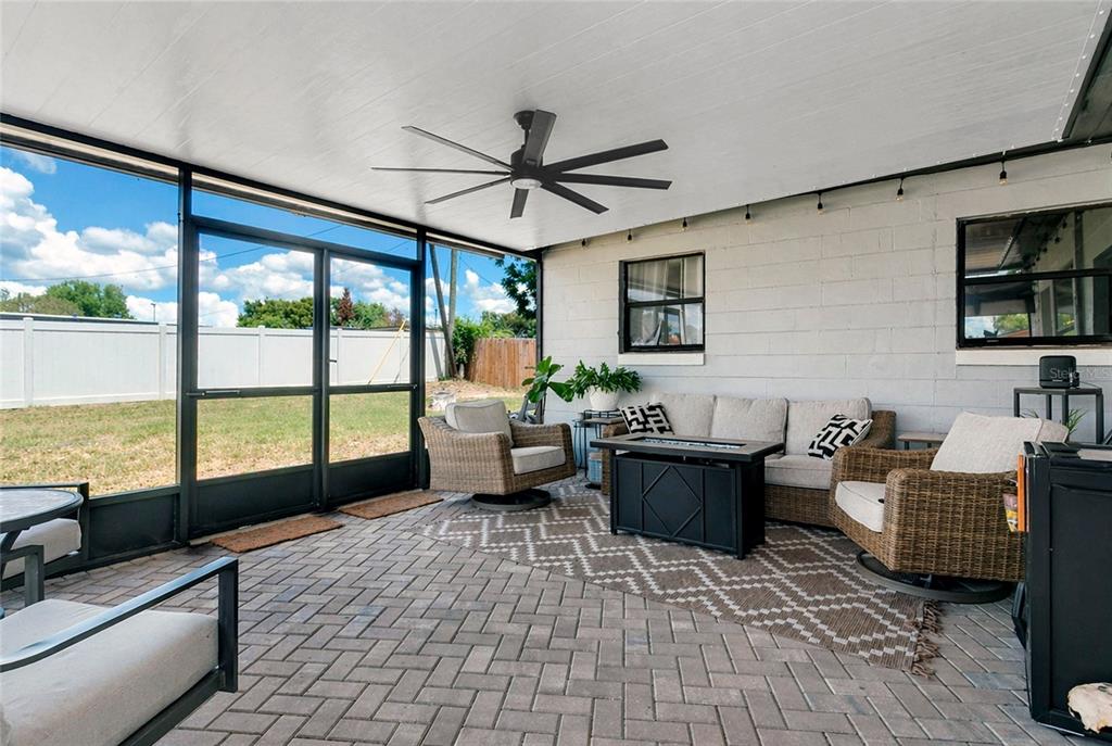 498 Clemson Drive Altamonte Springs, FL 32714 - Photo 19 of 31 a living room with furniture and a large window