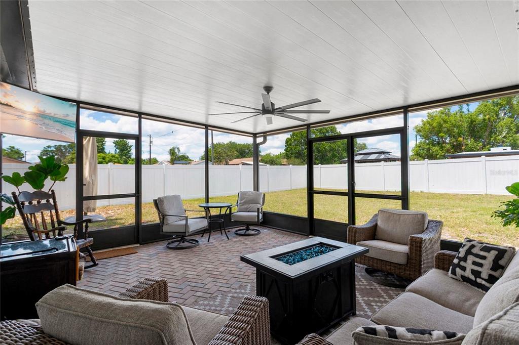 498 Clemson Drive Altamonte Springs, FL 32714 - Photo 21 of 31 a living room with furniture and floor to ceiling windows