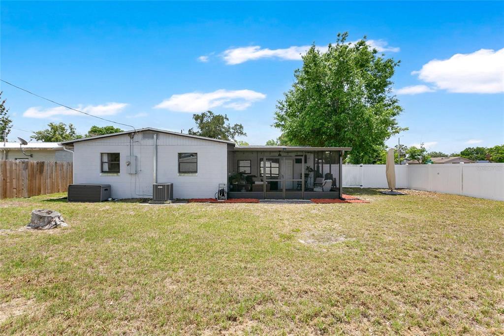 498 Clemson Drive Altamonte Springs, FL 32714 - Photo 24 of 31 a backyard of a house with yard and outdoor seating