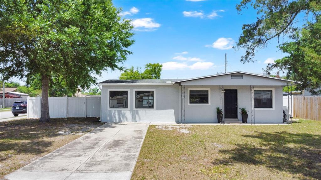 498 Clemson Drive Altamonte Springs, FL 32714 - Photo 26 of 31 a front view of a house with a yard and garage