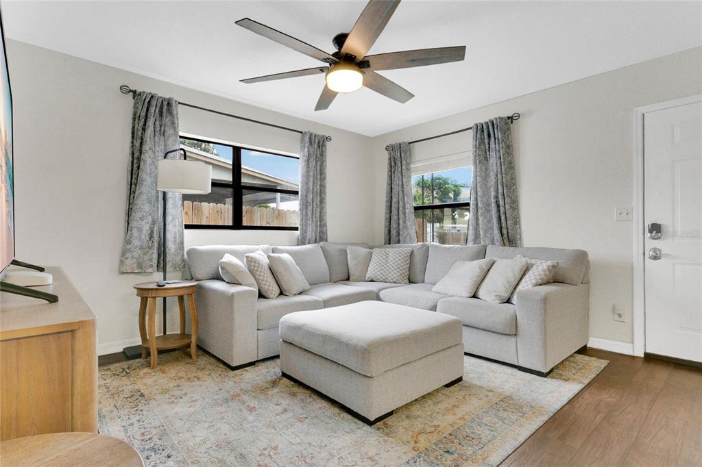 498 Clemson Drive Altamonte Springs, FL 32714 - Photo 7 of 31 a living room with furniture and a window