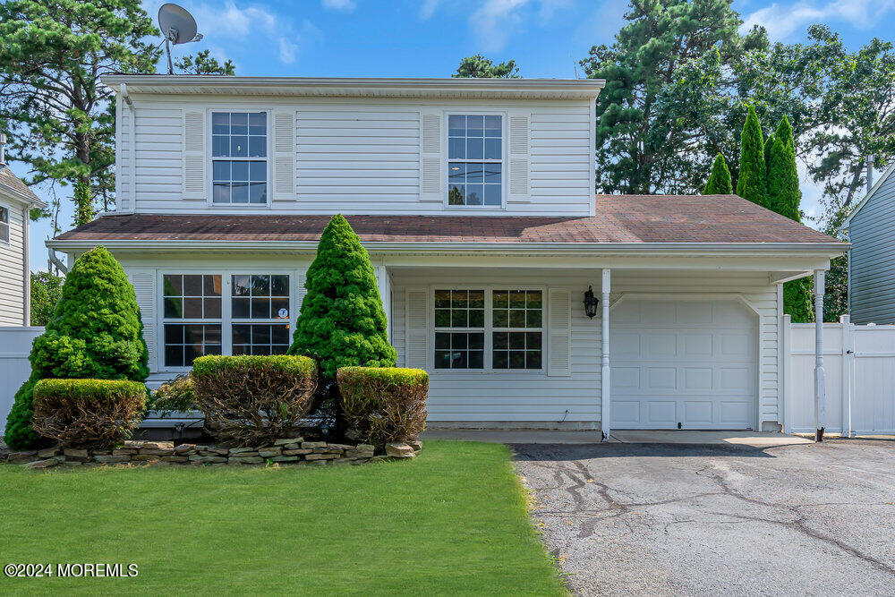 233 Timberline Road Toms River, NJ 08753 - Photo 1 of 38 a front view of a house with a yard and porch