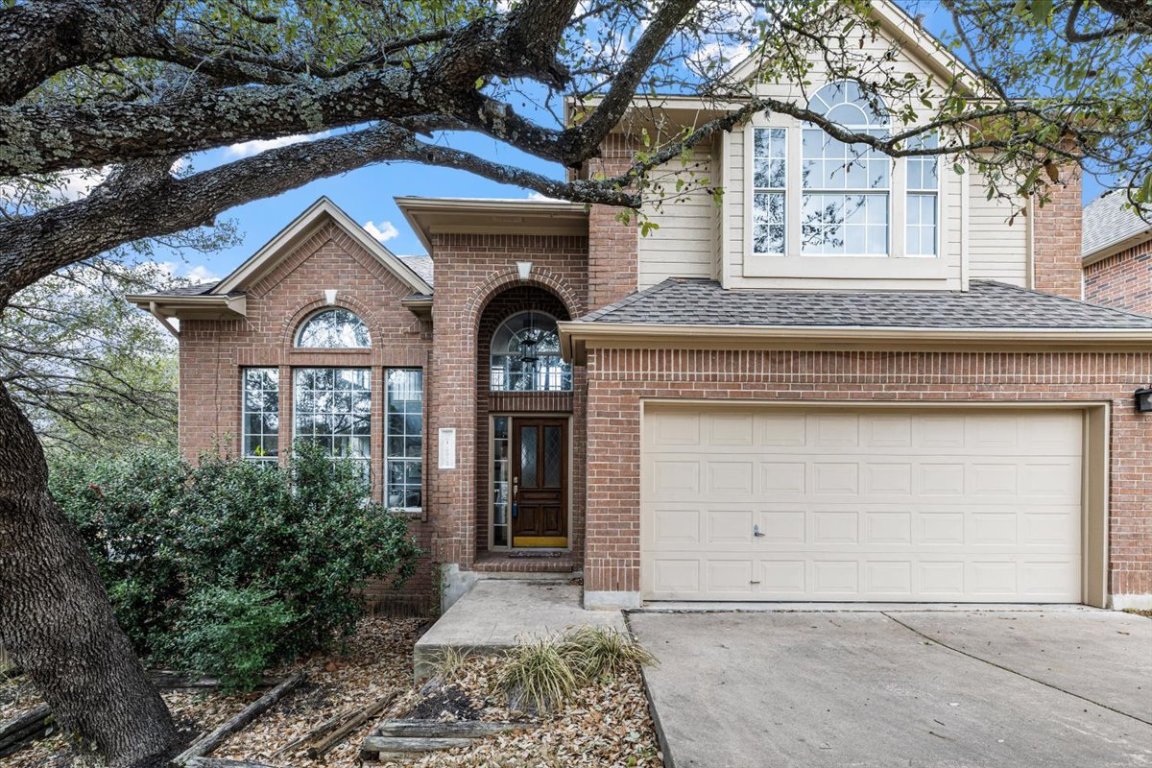 10912 Chestnut Ridge Road Austin, TX 78726 - Photo 1 of 1 a front view of a house with a garage