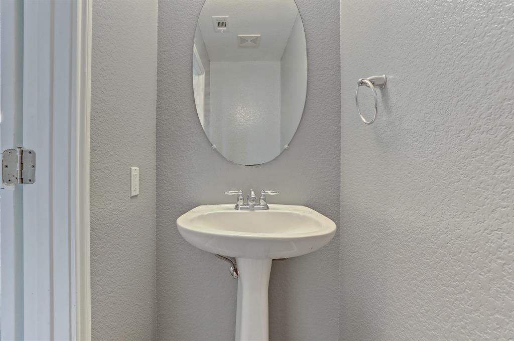 5913 Silver Screen Drive Austin, TX 78747 - Photo 13 of 31 a bathroom with a sink and a mirror
