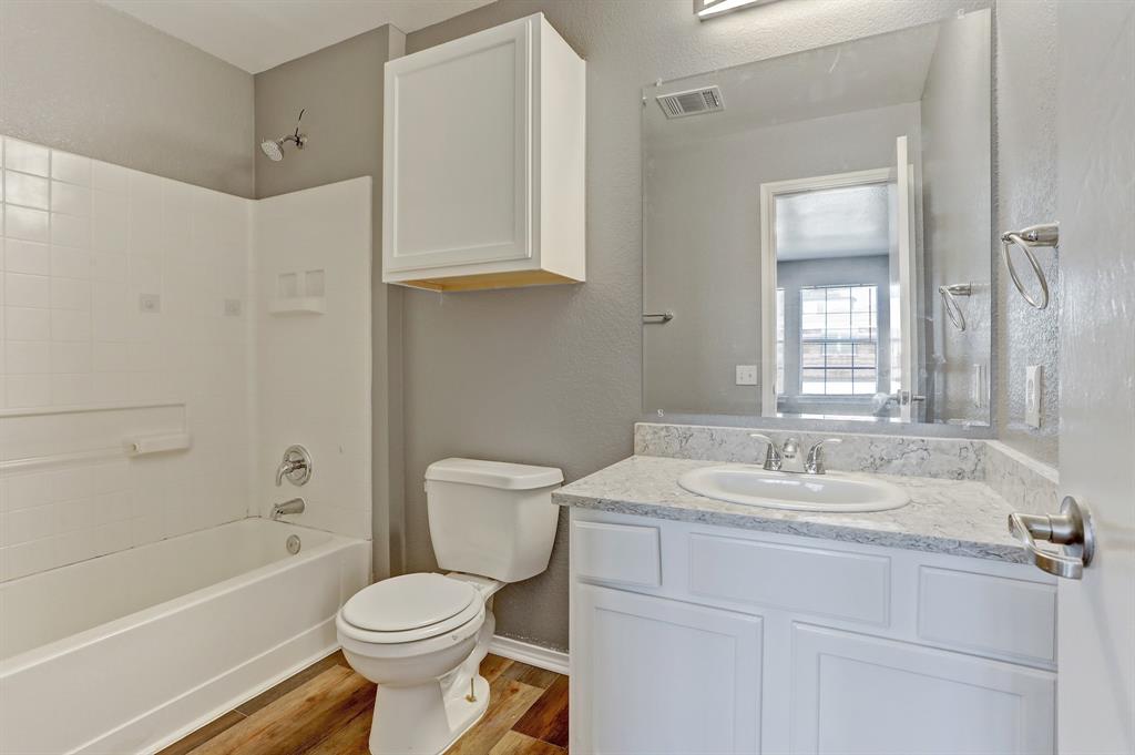 5913 Silver Screen Drive Austin, TX 78747 - Photo 16 of 31 a bathroom with a sink toilet and shower