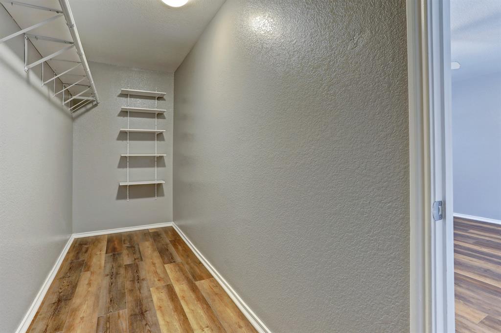 5913 Silver Screen Drive Austin, TX 78747 - Photo 17 of 31 a view of a room with racks on the wall