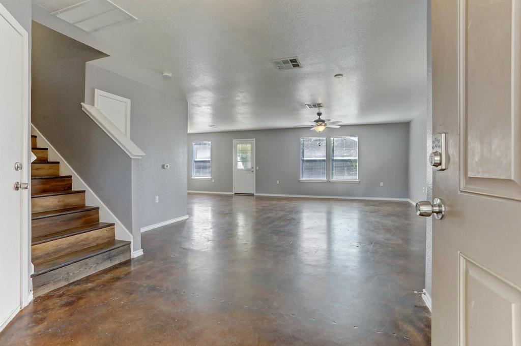 5913 Silver Screen Drive Austin, TX 78747 - Photo 3 of 31 wooden floor in an empty room with a window