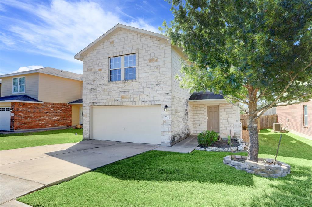 5913 Silver Screen Drive Austin, TX 78747 - Photo 31 of 31 a view of a house with a yard and a large tree
