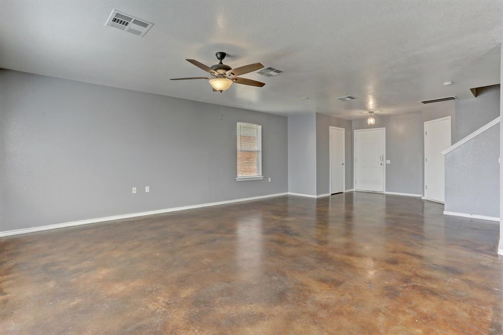 5913 Silver Screen Drive Austin, TX 78747 - Photo 8 of 31 a view of an empty room with a window