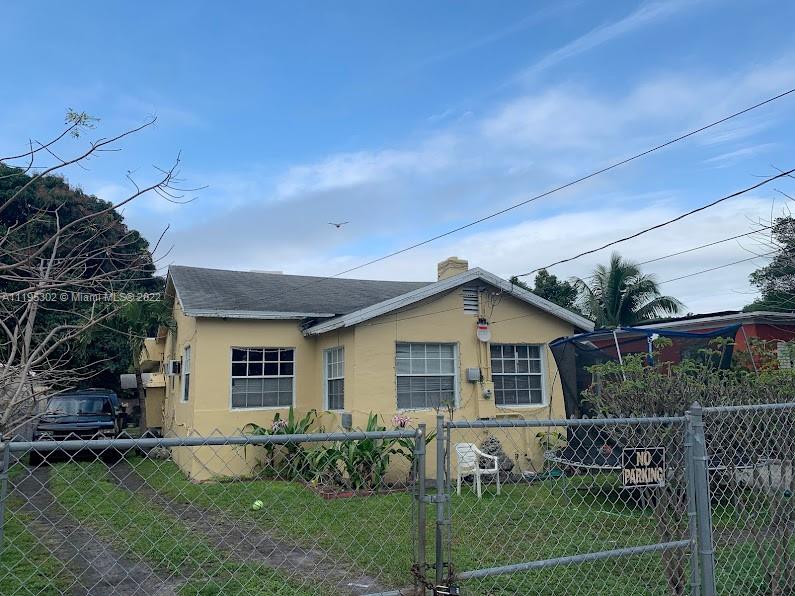 3040 Northwest 13th Avenue Miami, FL 33142 - Photo 2 of 51 a view of a house with a yard