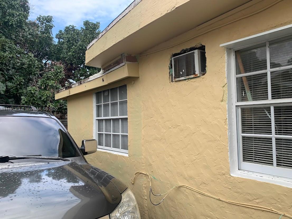 3040 Northwest 13th Avenue Miami, FL 33142 - Photo 23 of 51 a house view with a backyard space