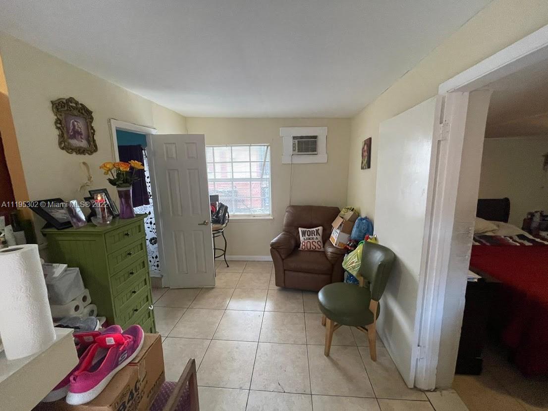 3040 Northwest 13th Avenue Miami, FL 33142 - Photo 36 of 51 a living room with furniture and a window
