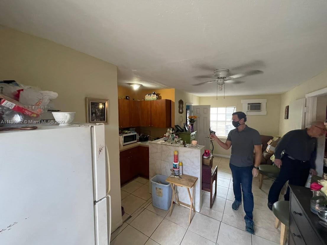 3040 Northwest 13th Avenue Miami, FL 33142 - Photo 38 of 51 a living room with furniture a window and gym equipment