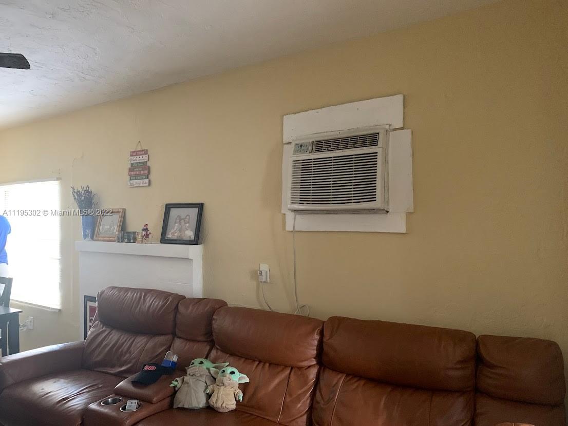 3040 Northwest 13th Avenue Miami, FL 33142 - Photo 39 of 51 a living room with furniture and a couch
