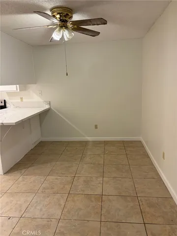 a view of a kitchen with a sink cabinets and utility room