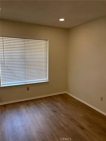 wooden floor and window in an empty room