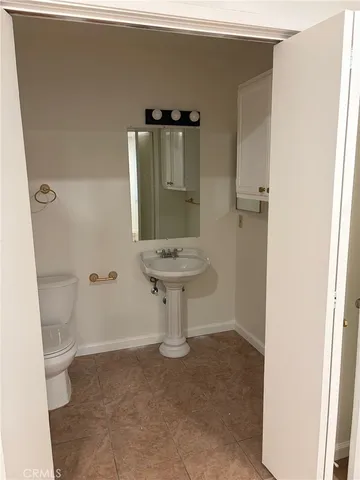 a bathroom with a sink and toilet