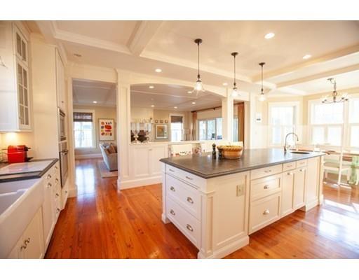 34 Leighton Road Wellesley, MA 02482 - Photo 6 of 21 a large white kitchen with kitchen island a counter top space a sink and a center island