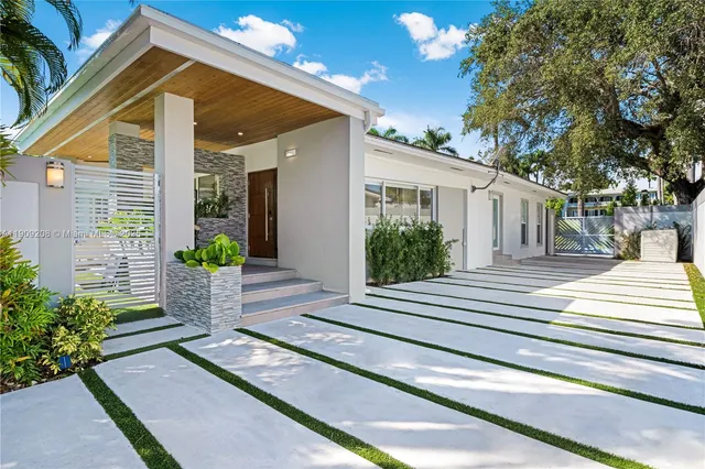 a view of a house with a small garden