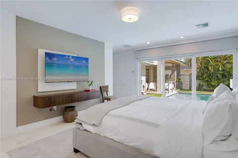 a bathroom with a tub a sink and a mirror