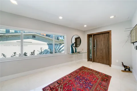a living room with furniture and a rug