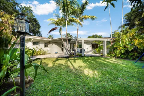 a view of an outdoor sitting area with furniture