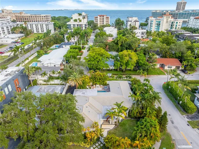an aerial view of a house with a yard and plants