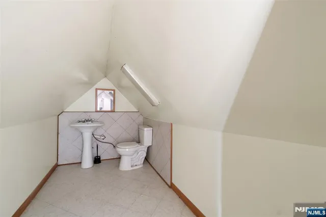 a view of entryway with wooden floor and front door