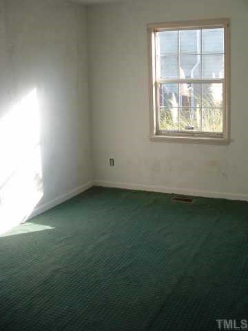 4005 Wheaton Road Durham, NC 27704 - Photo 4 of 7 an empty room with a window